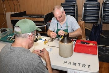 Volunteers work on rewiring a lamp brought into the Repair Cafe hosted by SalemRecycles on Aug 5. (Photo courtesy of Charlie Lipson)