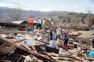 Volunteers sort through wreckage of home in Conway after tornado