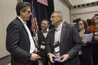Housing and Economic Development Secretary Jay Ash (left) discusses the administration’s economic development initiatives with Hopedale Selectmen Brian Keyes and Thomas Wesley at MSA Annual Business Meeting, Jan. 20.