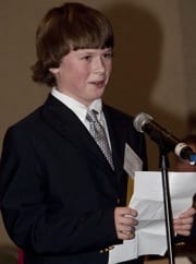 Colin Dale reads his first-place essay during the MMA Annual Meeting.