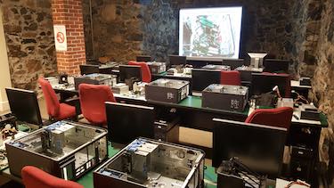 Partially disassembled computers await students before David Petto's class at the Belmont Senior Center