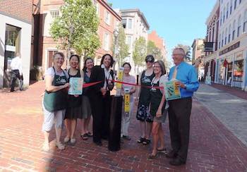 Mayor Kim Driscoll cuts the ribbon at the relaunch of the 'Park Your Butts' cigarette disposal campaign
