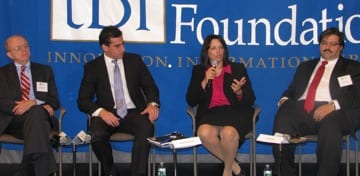 Salem Mayor Kim Driscoll speaks during a May 5 panel discussion at The Boston Foundation. Also pictured are (l-r) Mass. Taxpayers Foundation President Michael Widmer, Boston City Council President Michael Ross, and Joel Barrera of the MAPC.