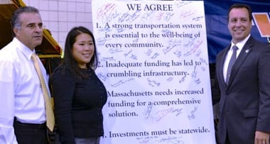 Mayors Dean Mazzarella of Leominster, Lisa Wong of Fitchburg and Mark Hawke of Gardner (l-r) stand beside a transportation pledge that they signed.