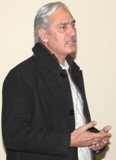 Muhammad Farooq, a civil servant in the Pakistani capital Islamabad, speaks during a farewell lunch at the MMA office on Nov. 9.