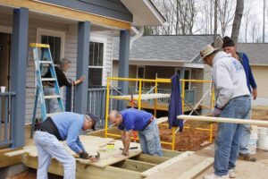 Volunteers for the nonprofit organization Habitat for Humanity work building new energy efficient houses